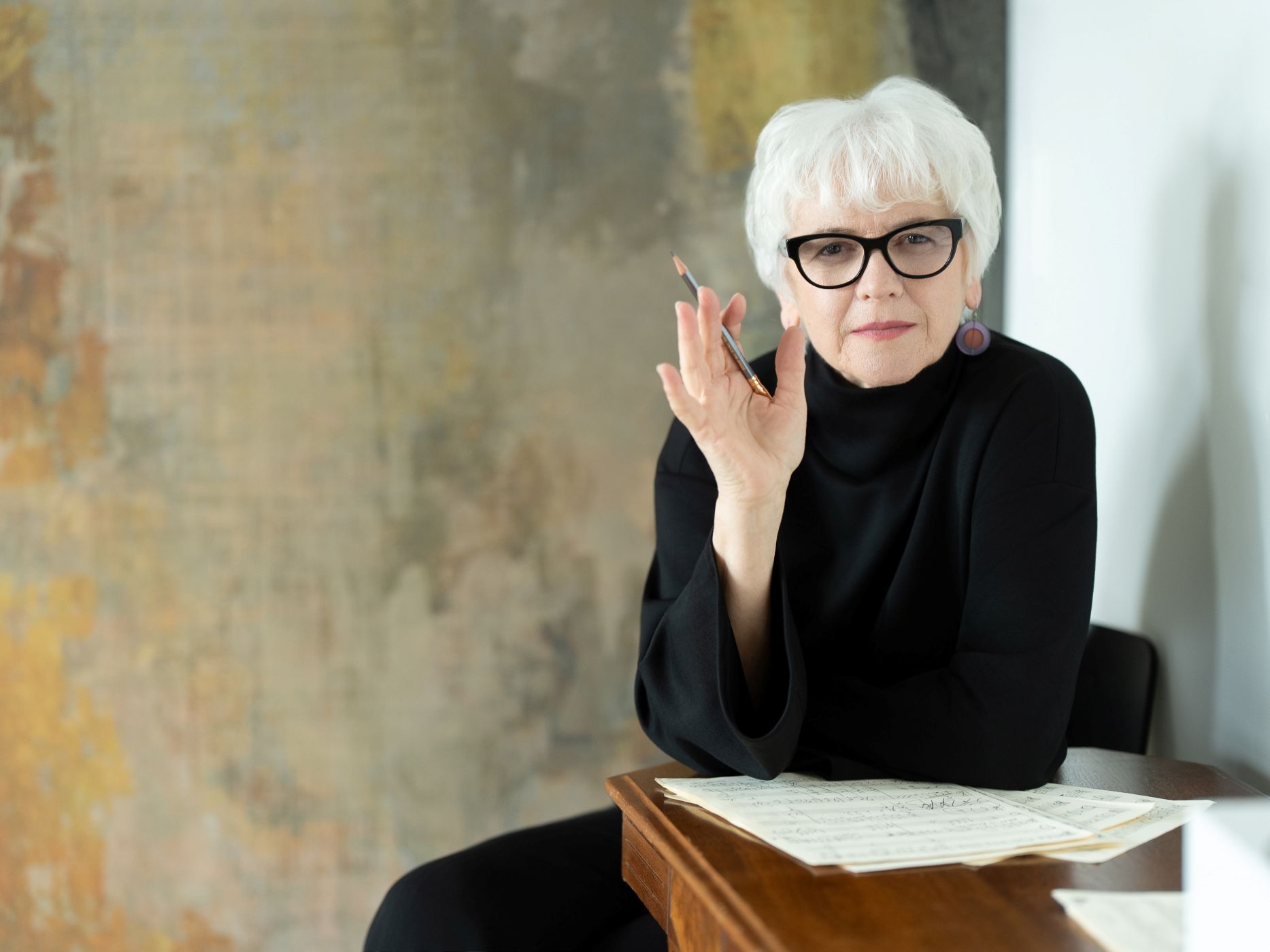 Portrait of Joan Szymko with music scores